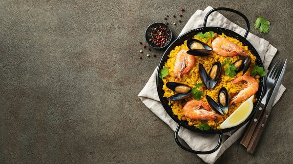 Comment préparer une paella valenciana avec des ingrédients traditionnels?